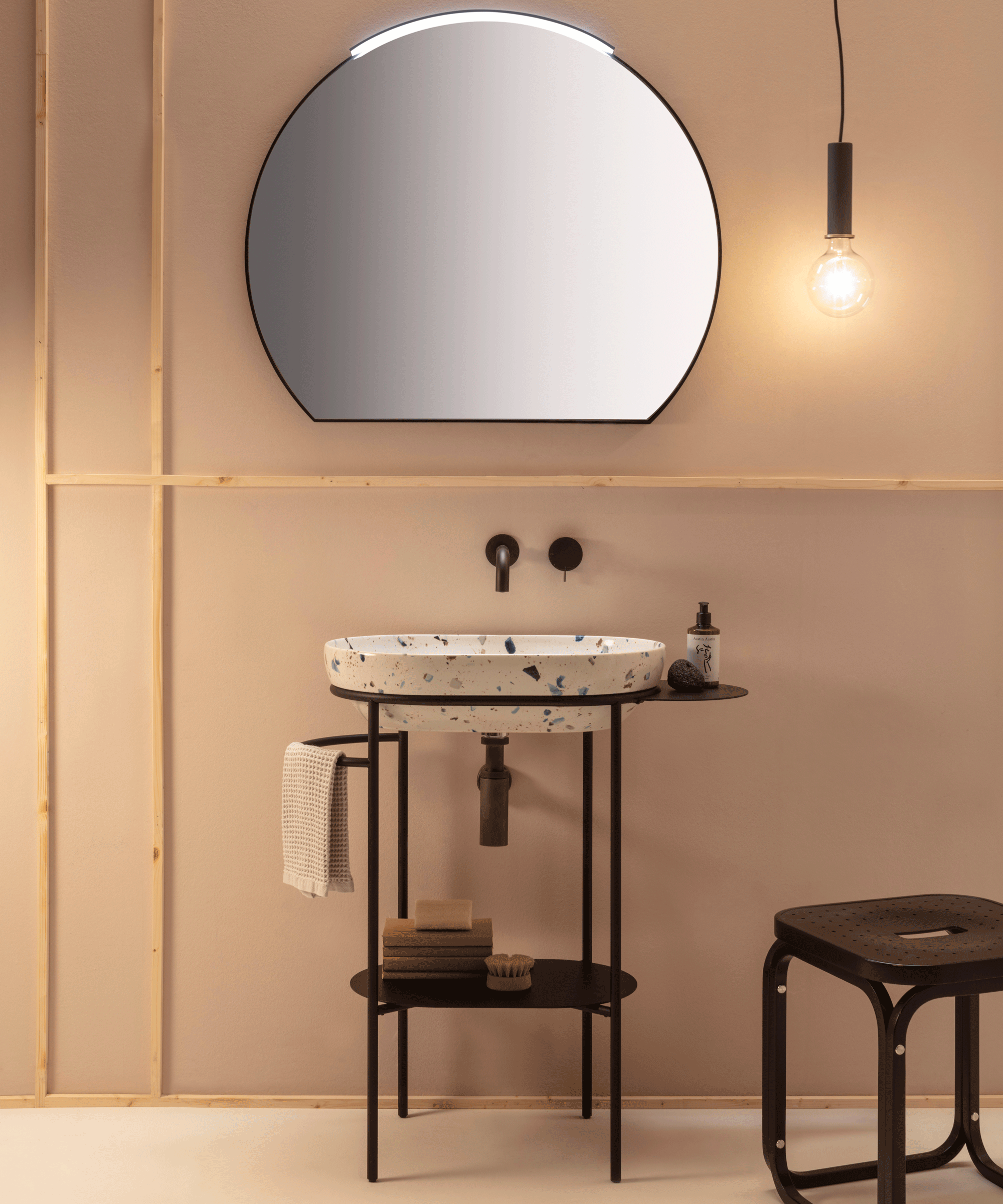 Terrazzo bathroom with cream walls and terrazzo sink