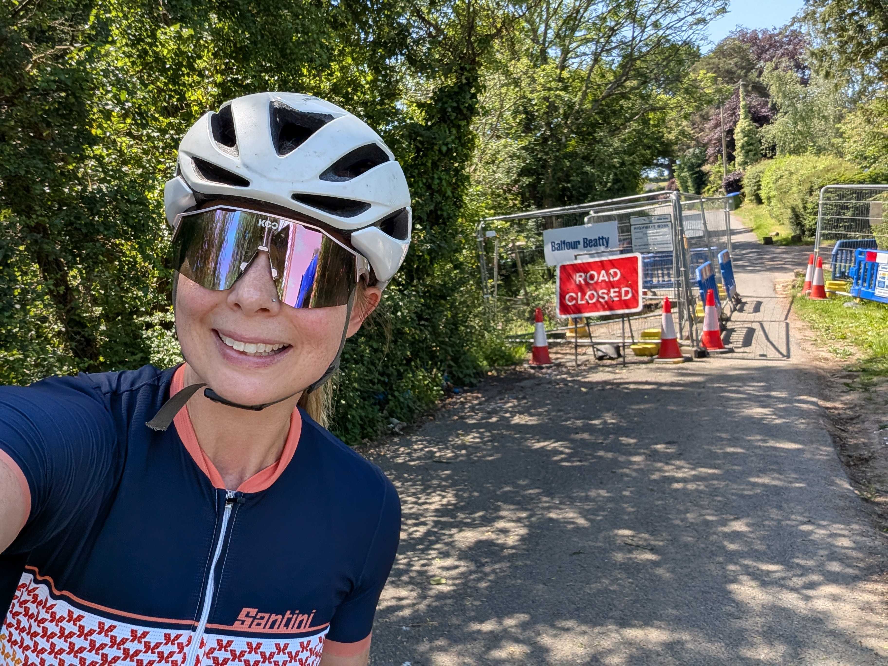 Michelle stands in front of road closure sign