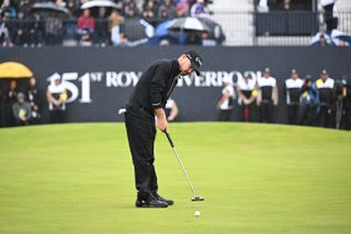 Brian Harman holes a putt on the 18th hole at The Open