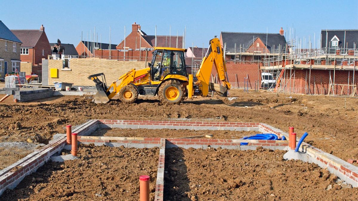 A housebuilding plot with unfinished houses