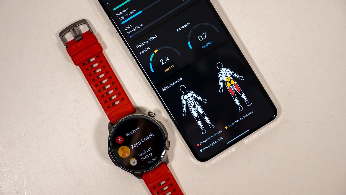 Looking at workout stats on the Zepp app next to the Amazfit Balance 2 smartwatch