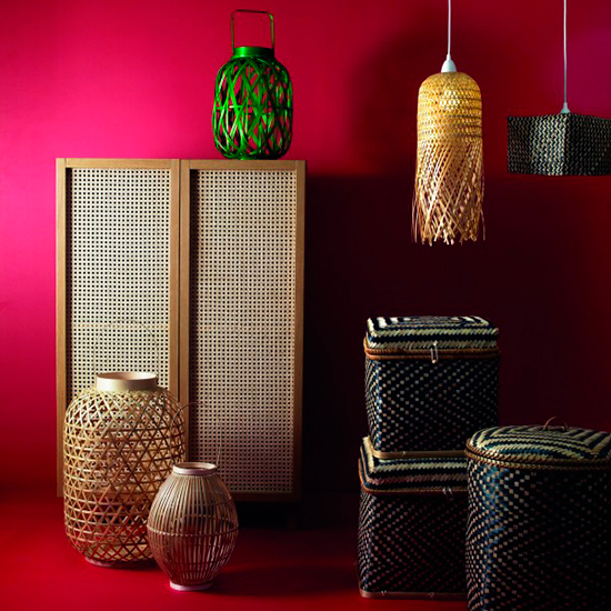 room with dark pink wall footstools and cane lantern