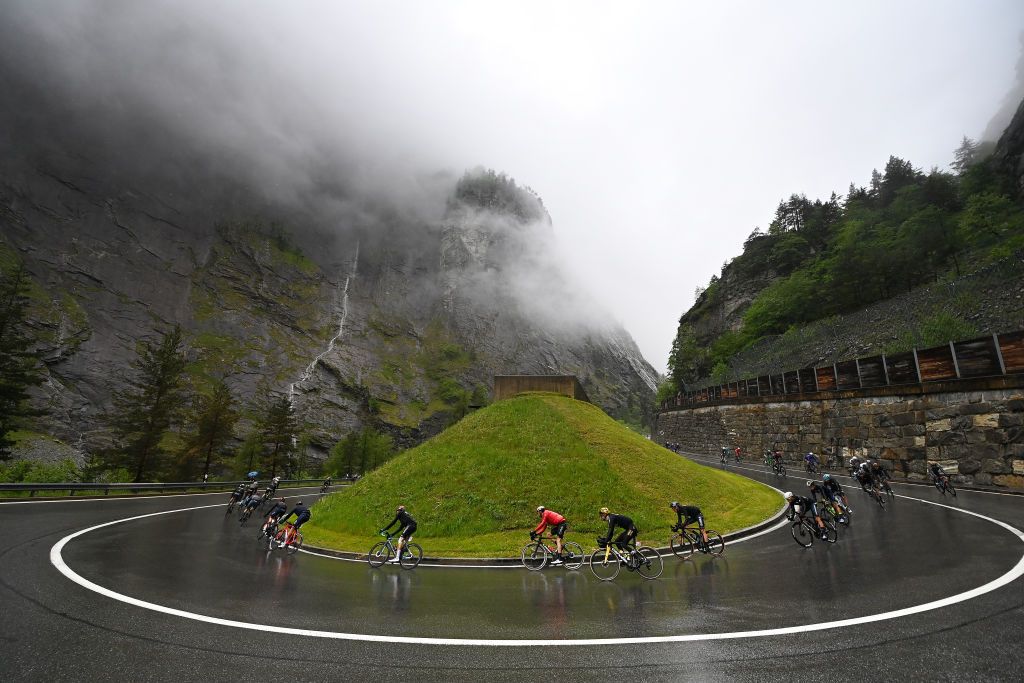 the peloton compete racing down the to the Simplon Pass - Passo del Sempione on stage 14