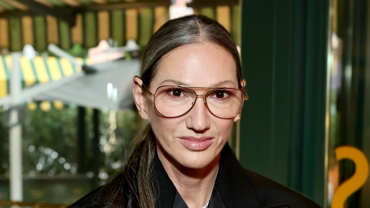 Jenna Lyons wearing glasses with hair in a ponytail