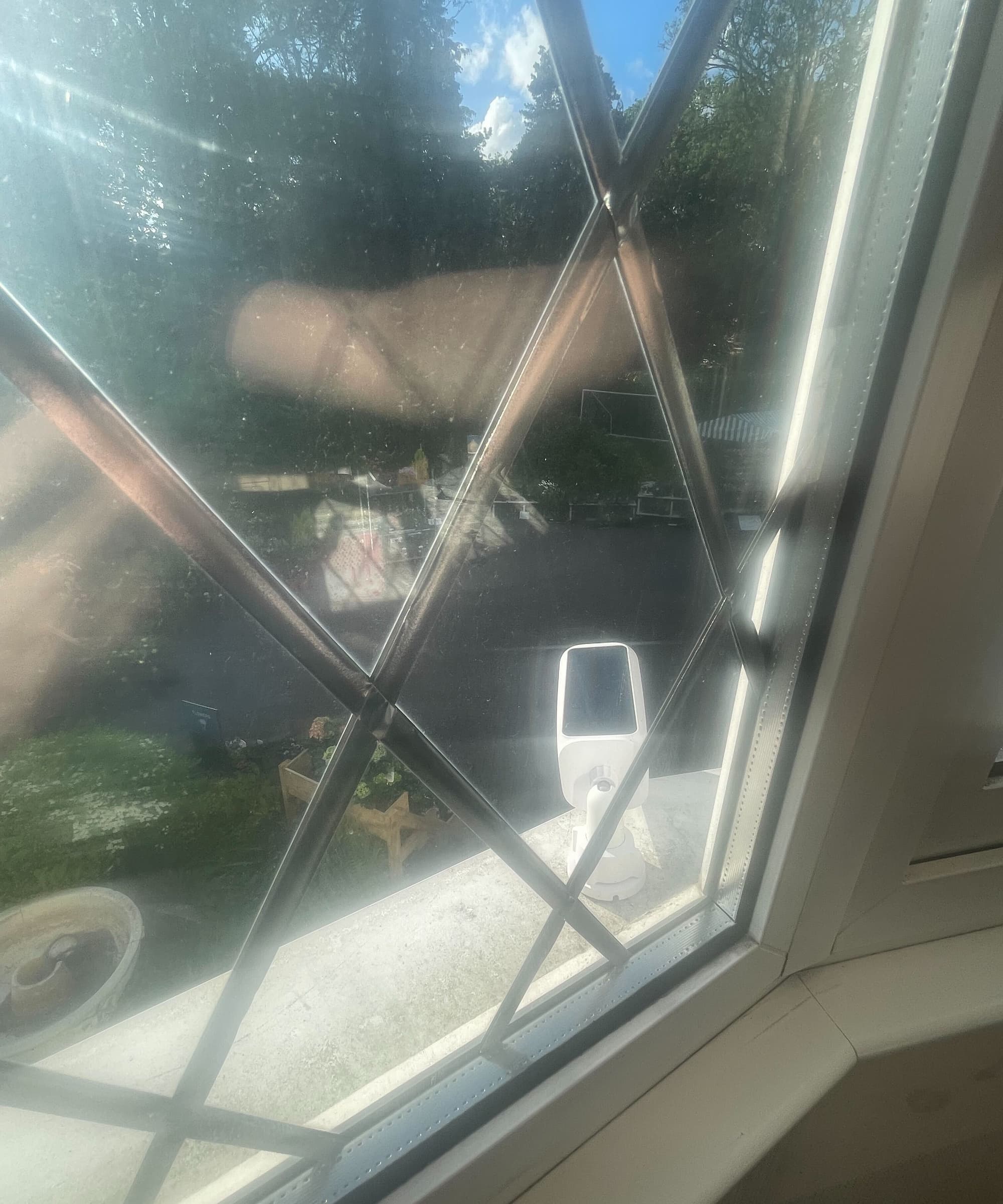A solar powered camera overlooking a driveway