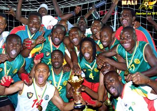 Cameroon players celebrate after winning the Africa Cup of Nations in 2002.