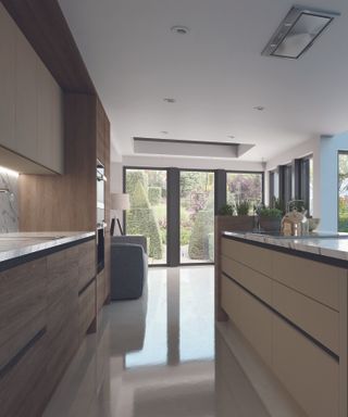 a galley kitchen with handleless wood cabinets, in a kitchen with bifold doors