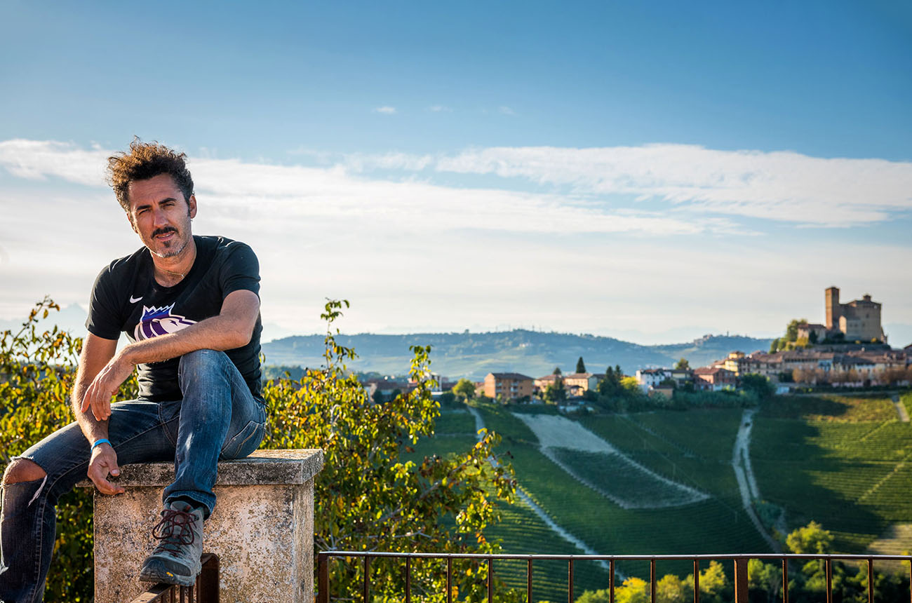 Enrico Rivetto, with the Barolo township of Serralunga d'Alba in the background.