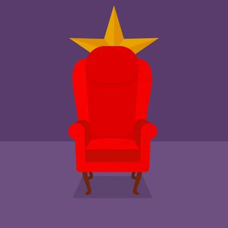 red wingback chair with purple background