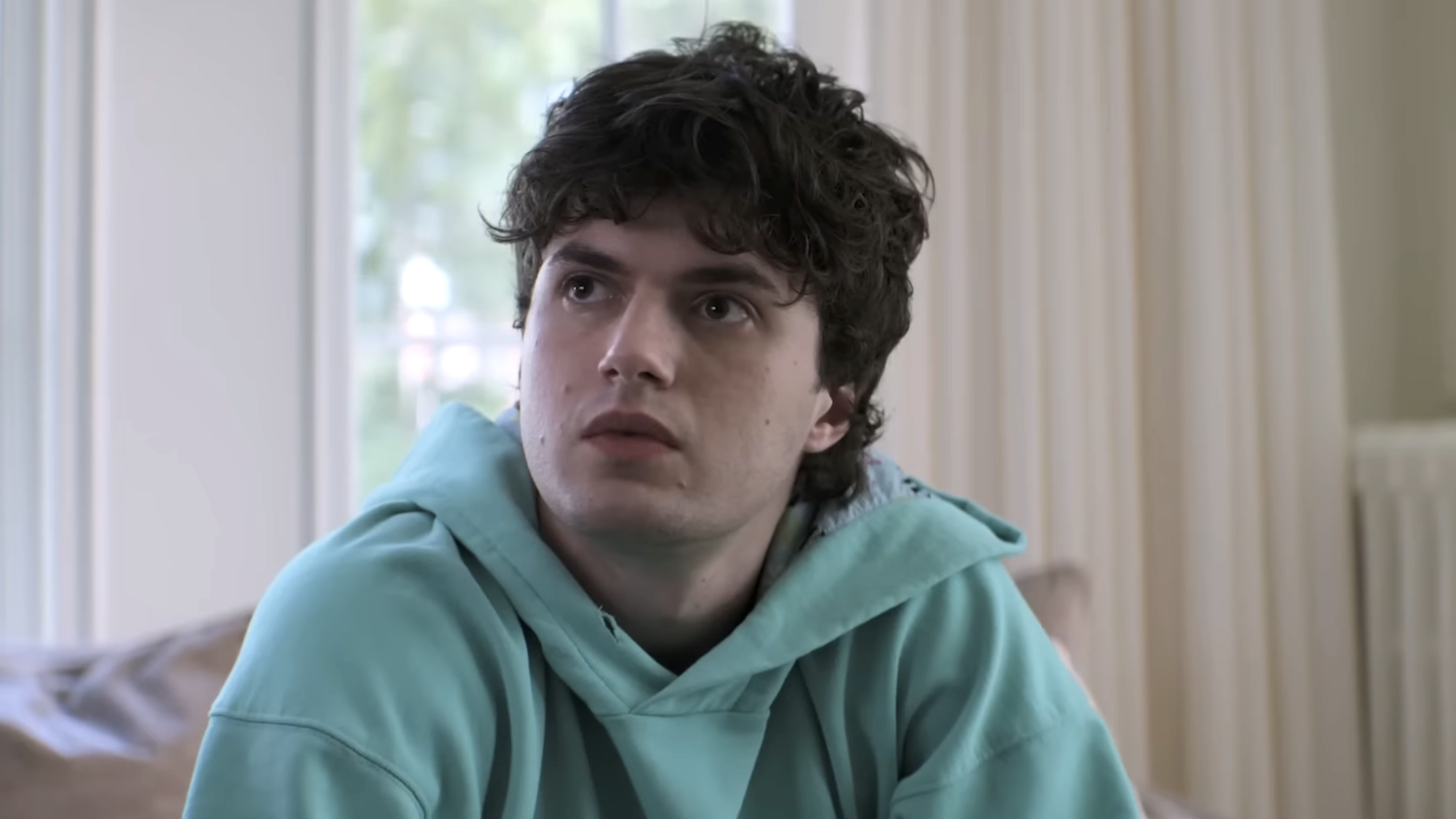 Keen Ruffalo in a teal sweatshirt in Sterling Point