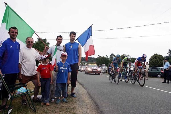Italian tifosi watch the breakaway go by