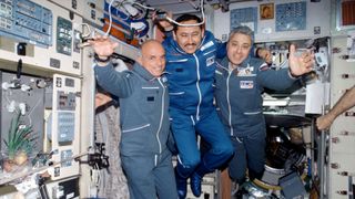 From the left: American businessman and spaceflight participant ("space tourist") Dennis Tito with Russian cosmonauts Talgat Musabayev and Yuri Baturin aboard the International Space Station on April 30, 2001.