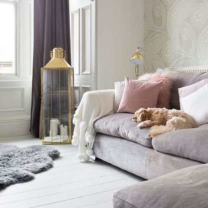 living room with wooden flooring and sofaset with cushions