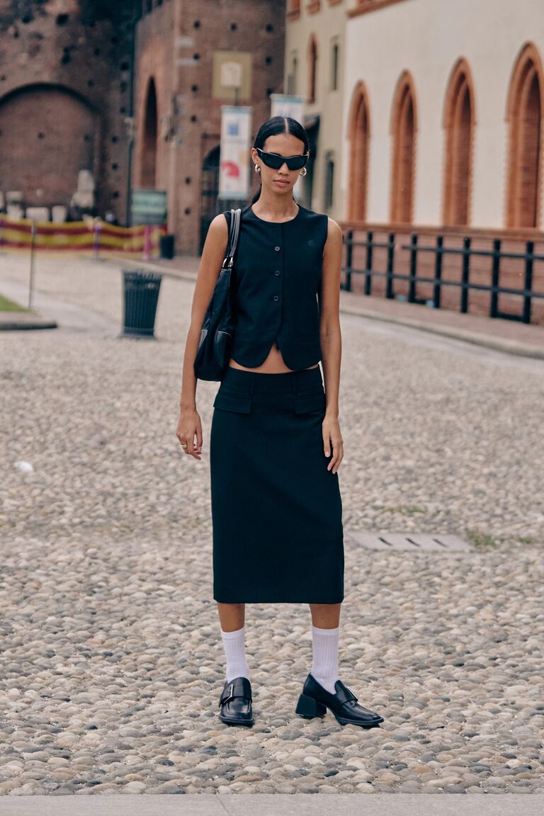 woman at fashion week wearing a loafer outfit