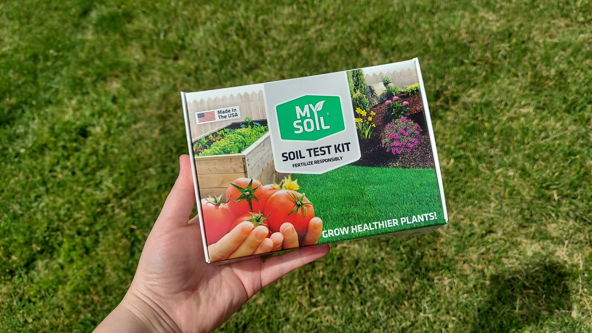 Gardener holding soil test kit box