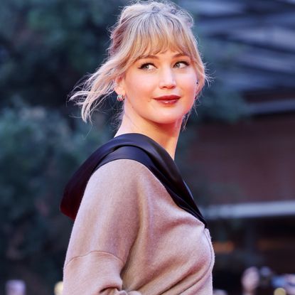 Jennifer Lawrence attempted to keep a low profile in a winter coat, a scarf, and her favorite Haflinger clogs