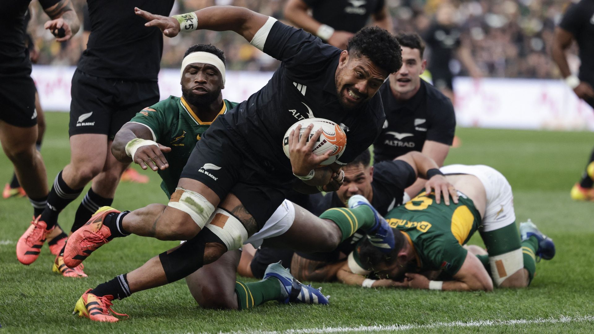 New Zealand's number eight Ardie Savea scores a try in the third Rugby's Greatest Rivalry international rugby union match against South Africa at the FNB Stadiu