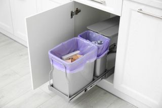 a pull out cabinet bin