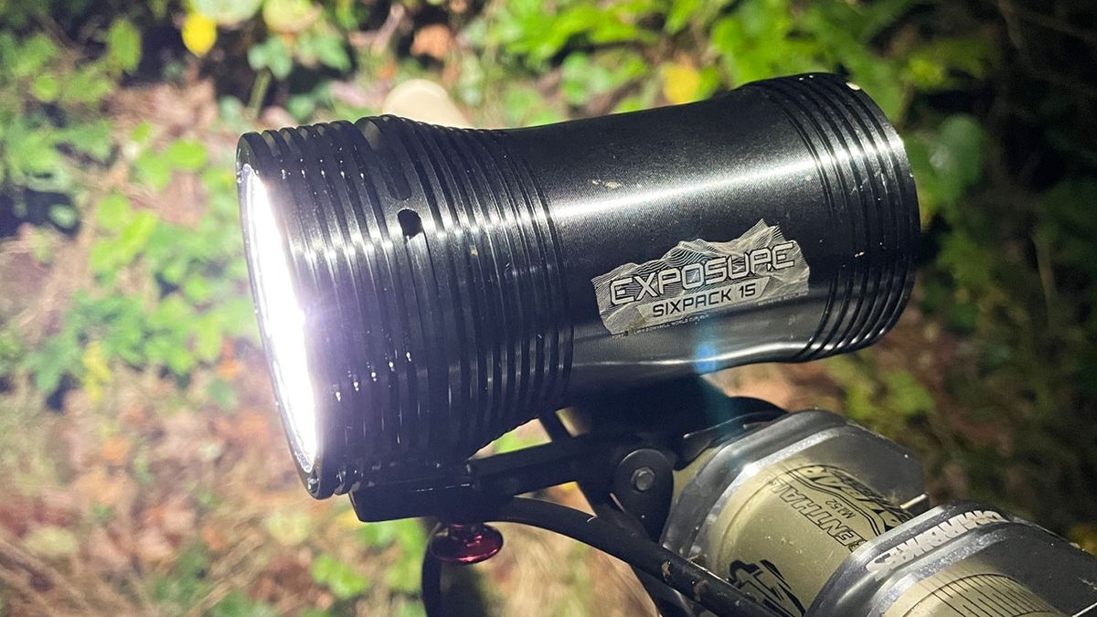 Exposure Six Pack 15 mounted to a MTB handlebar after dark