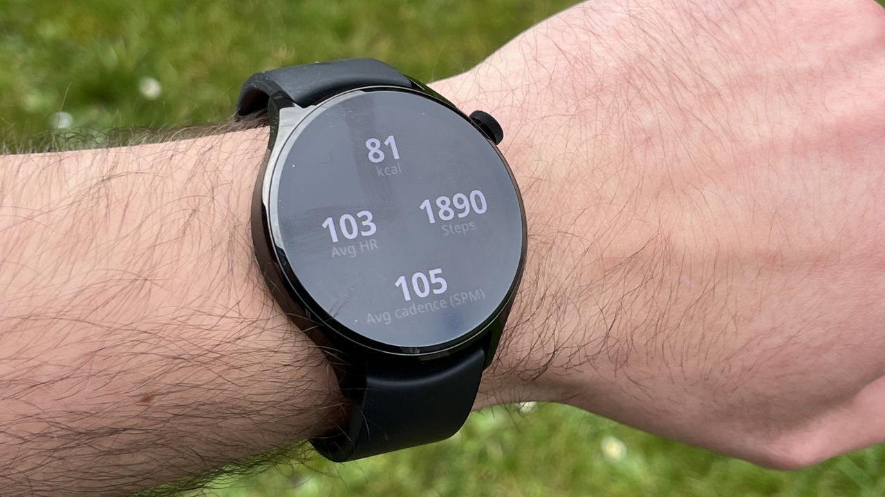 The Xiaomi Watch S1 Pro showing metrics from a workout, against a green background