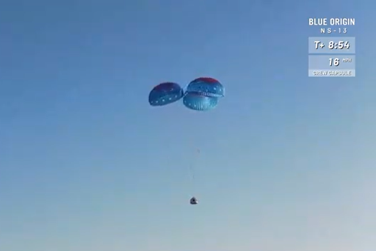 The crew capsule of Blue Origin's New Shepard vehicle slowed by parachutes during its landing on Oct. 13, 2020.
