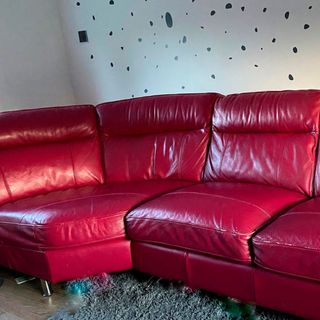 red leather sofa with white wall