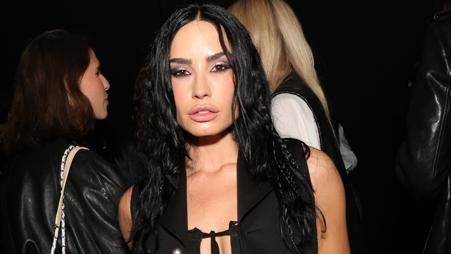 a woman with long dark hair pictured at a party
