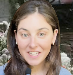 a white woman with a blue sweater and brown hair
