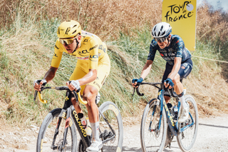Jonas Vingegaard follows Tadej Pogačar during the Tour de France gravel stage