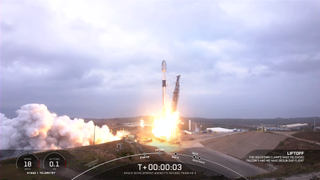 A white and black SpaceX rocket launches on the Tranche 0 mission for Space Force