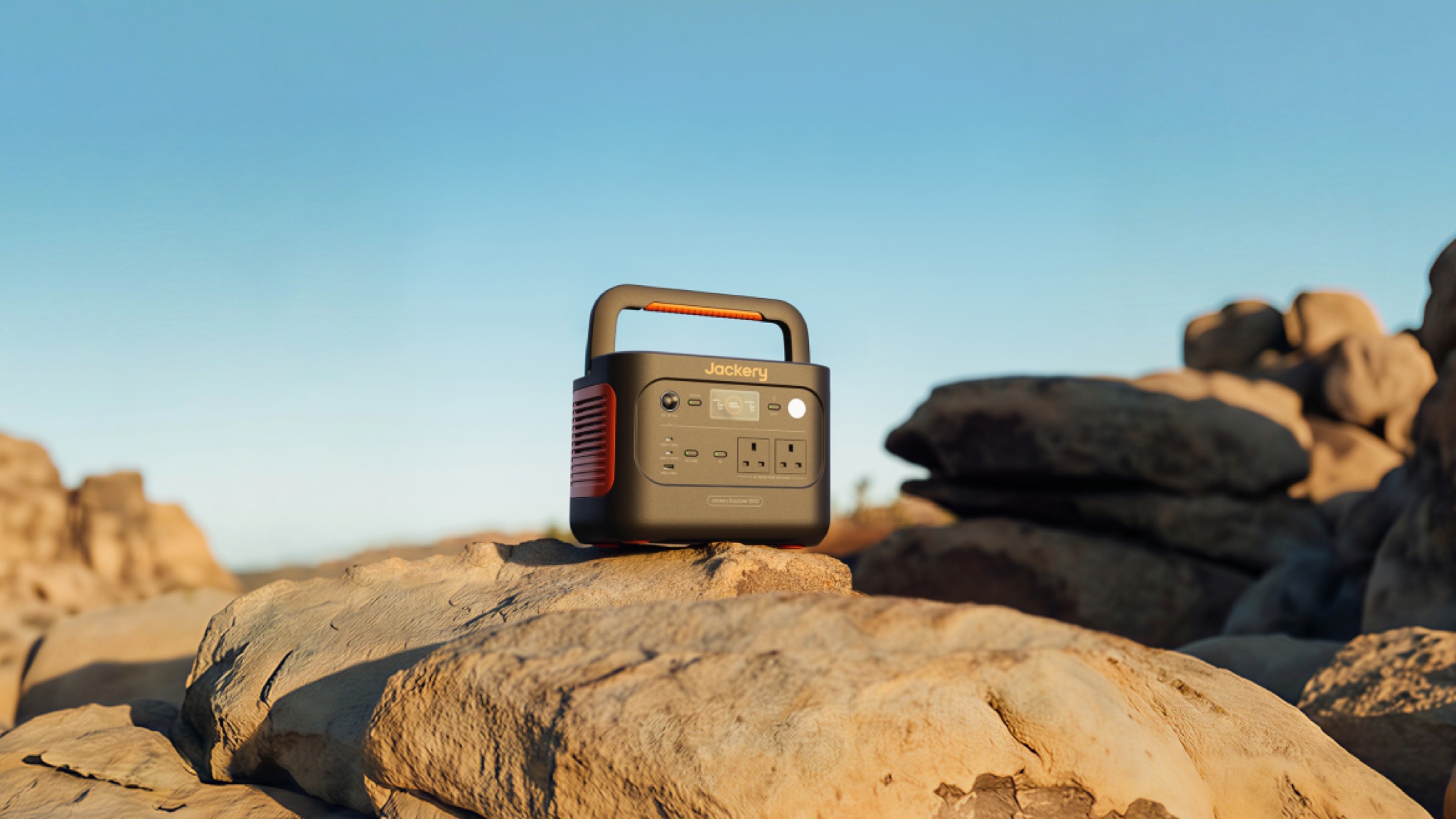 Jackery portable power station on top of a rock