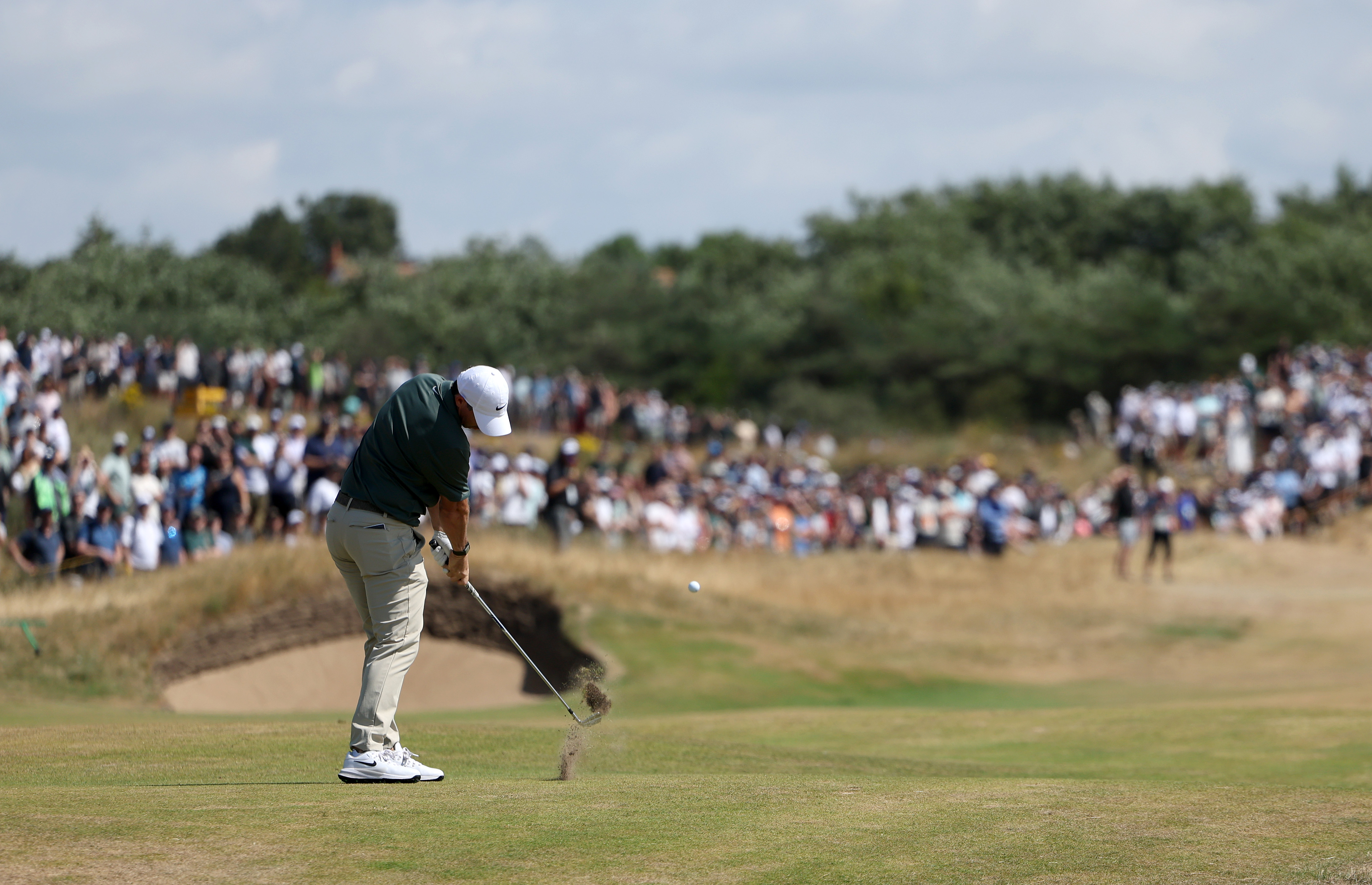 Rory McIlroy strikes an iron shot at the 2026 Open