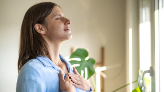 Woman inhaling her breath