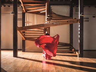 woman in red dancing in Isaac Julien artwork
