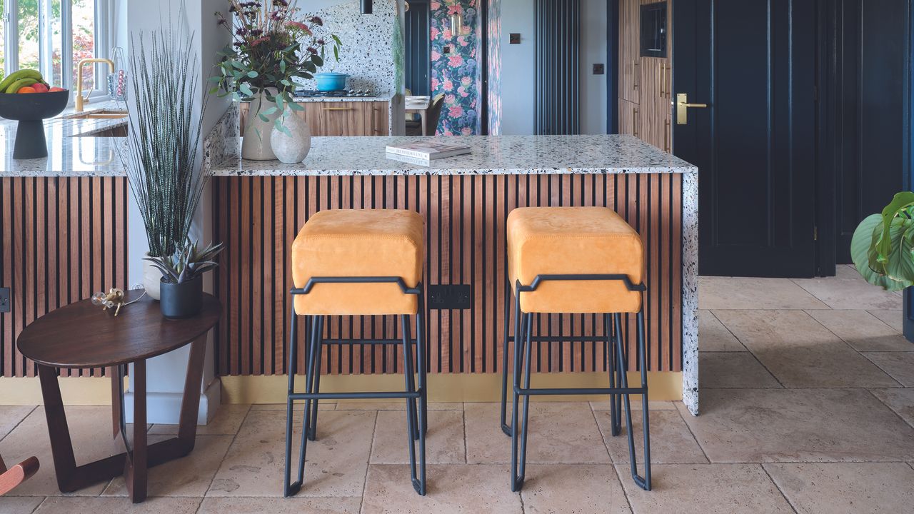 Kitchen with wooden panelled island 