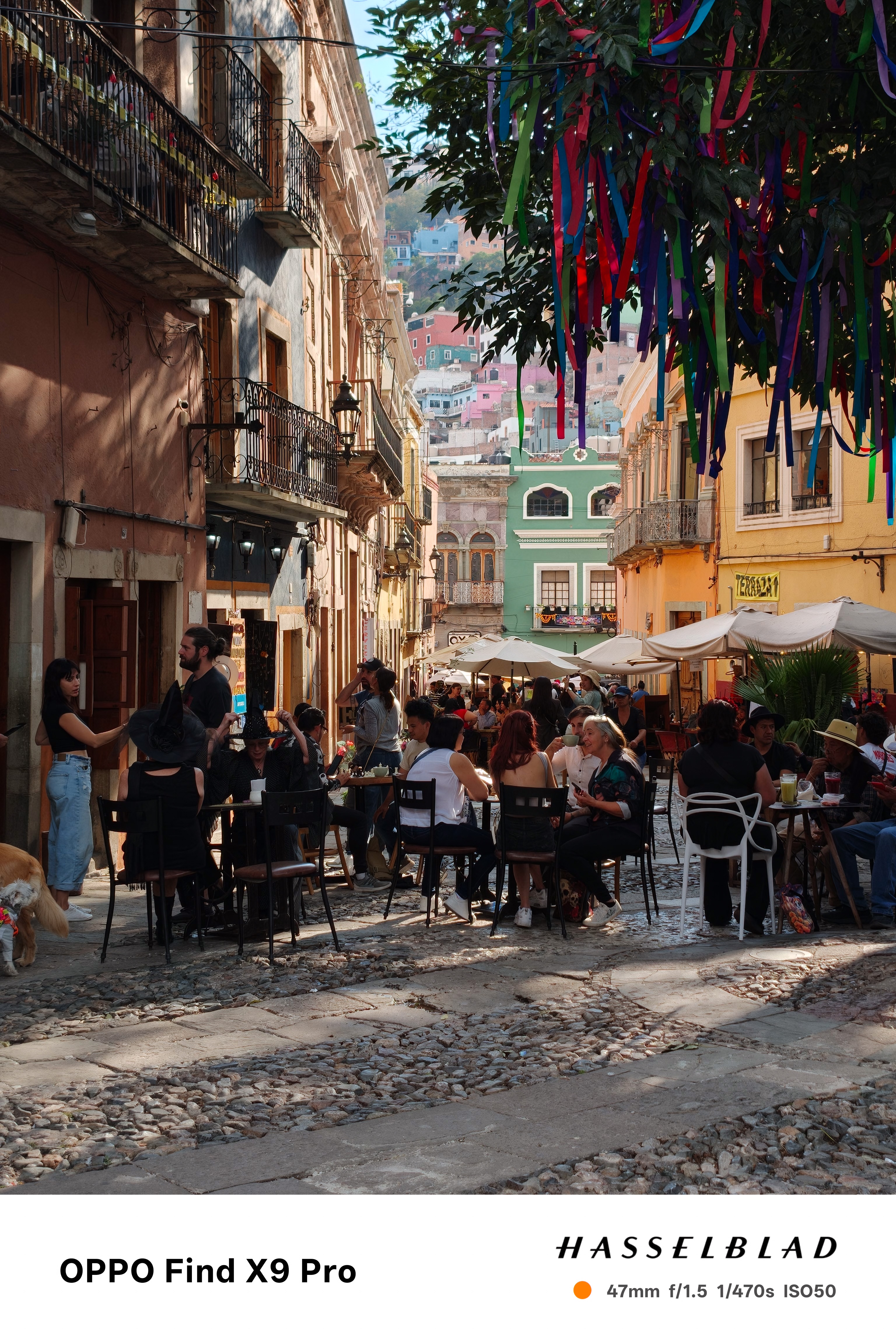 Many people sitting eating and drinking in a square in Guanajuato Mexico
