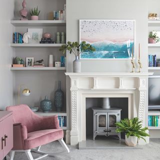 Grey living room with pink chair and painting
