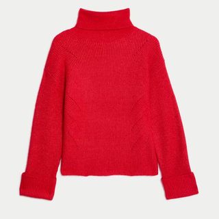 A cut out of a red roll neck jumper from M&S against a light background