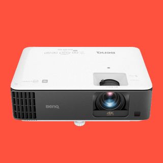 BenQ TK700STi gaming projector on colourful background