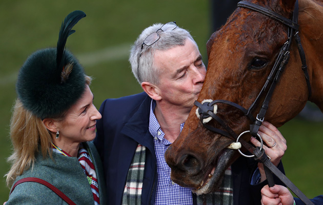 The winning kiss: CEO of Ryanair Michael O’Leary congratulates Balko Des Flos after victory in the Ryanair Chase