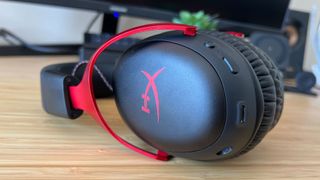 Close up on HyperX Cloud 3 Wireless left cup showing controls and logo
