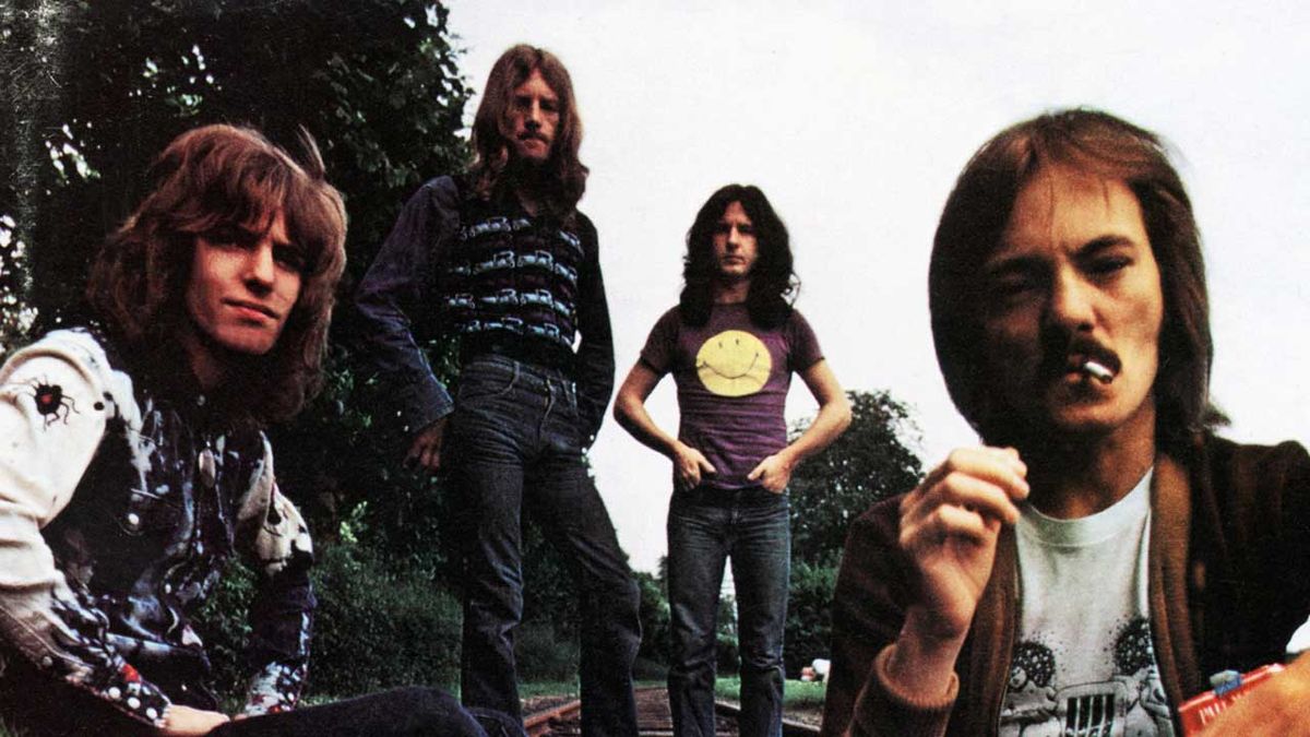 Humble Pie posing on a railway line