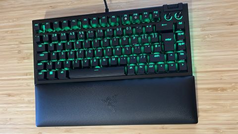 Razer BlackWidow V4 75% keyboard on a wooden desk top
