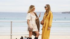 two models wearing fashionable Australian clothing brands by the sea