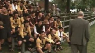 A group of soccer players being address by a coach in The Game Of Their Lives