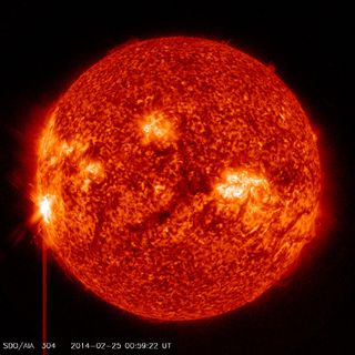 A massive X4.9 solar flare erupts from a long-lived sunspot on the sun at 00:49 GMT on Tuesday, Feb. 25 (7:49 p.m. Monday, Feb. 24 EST) in this view from one of many light wavelength observations by NASA's Solar Dynamics Observatory.