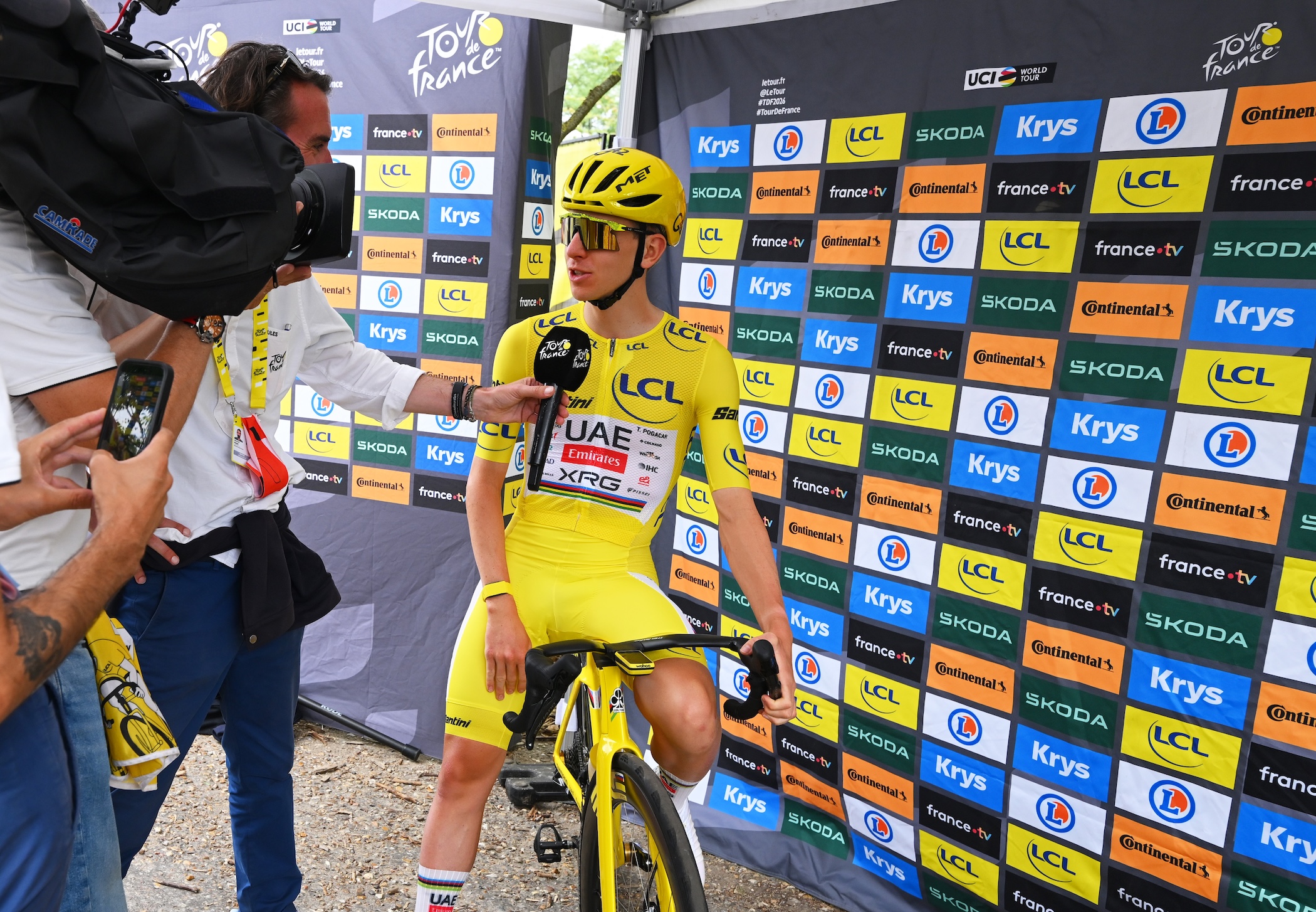 Tadej Pogačar of UAE Team Emirates-XRG handles a Tour interview prior to stage 21 depart 