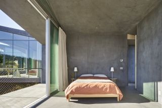 a bedroom painted in a concrete grey paint