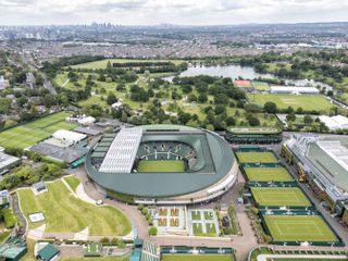 Aerial view of Wimbledon's Centre and Number one court with London in the background