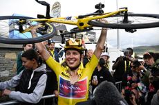 Katarzyna Niewiadoma celebrates after crossing the finish line and winning the third edition of the Women's Tour de France